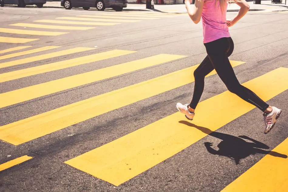 o_blonde-woman-running-over-the-pedestrian-crossing-picjumbo-com_20200410134841